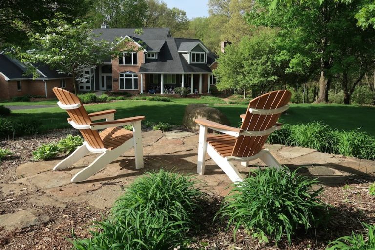 two chairs in side yard